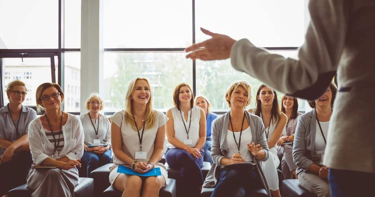 Speaker presenting to engaged professional audience